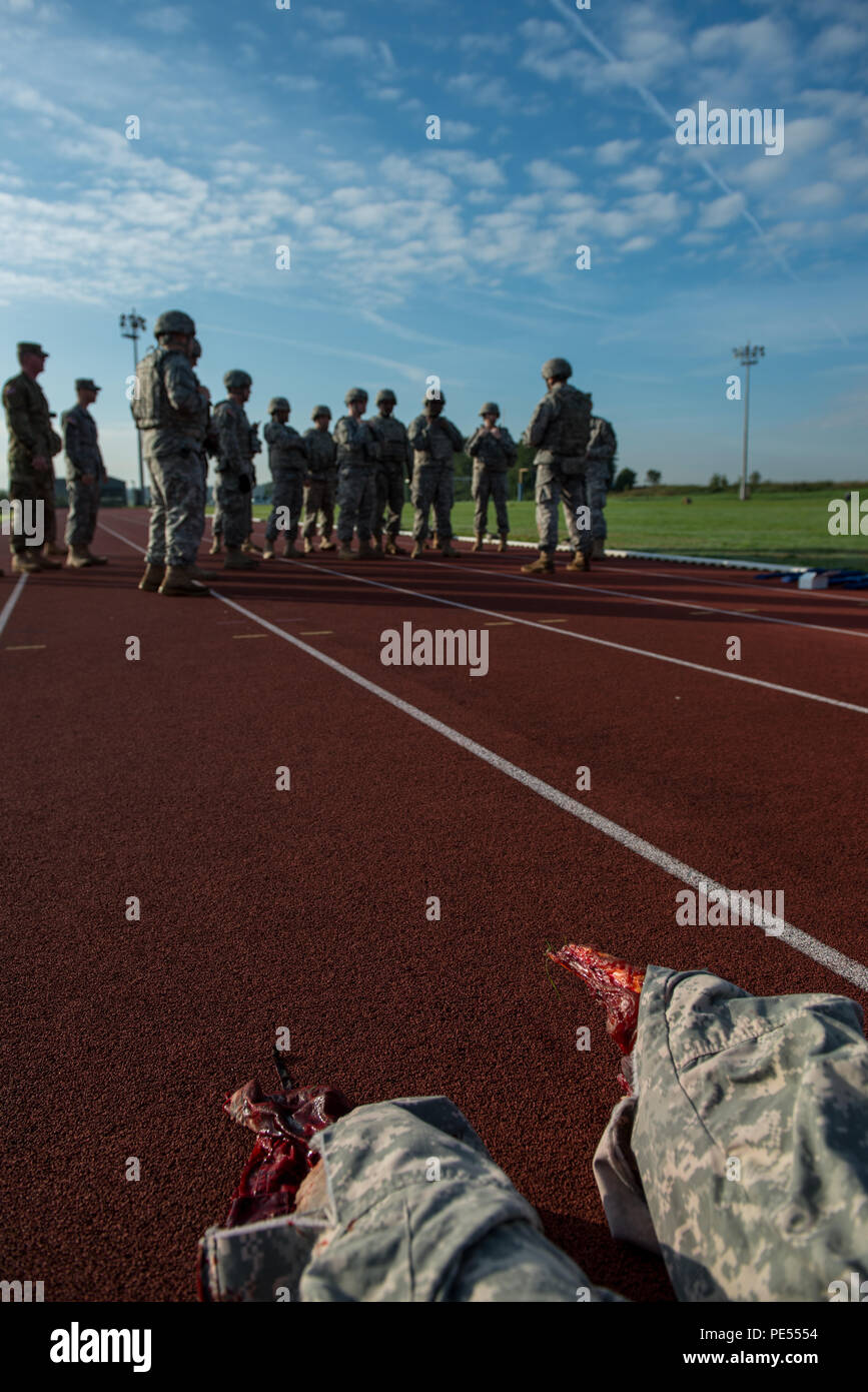 View of the realistic broken limbs of a training mannequin as U.S. Soldiers with 128th Signal Company and Headquarters and Headquarters Detachment, 39th Signal Battalion, listen to instructions about the Combat Life Saver exercises they will practice during the Battalion Commander's Prime Time Training, on Chièvres Air Base, Chièvres, Belgium, Sept. 21, 2015. (U.S. Army photo by Visual Information Specialist Pierre-Etienne Courtejoie/Released) Stock Photo