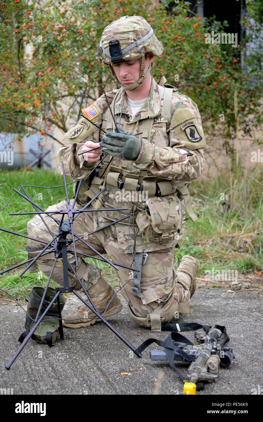 U.S. Army Sgt. Michael Praet, a paratrooper assigned to 1st Squadron, 91st Cavalry Regiment, 173rd Airborne Brigade, prepares a radio for a mission as part of Exercise Sky Soldier II at Bechyne Training Area, Czech Republic, Sept. 23, 2015. Sky Soldier is a series of bilateral exercises between the 173rd Airborne and Czech army’s 4th Rapid Reaction Brigades designed to increase interoperability and strengthen partnerships between NATO airborne forces. (U.S. Army photo by Visual Information Specialist Gertrud Zach/released) Stock Photo
