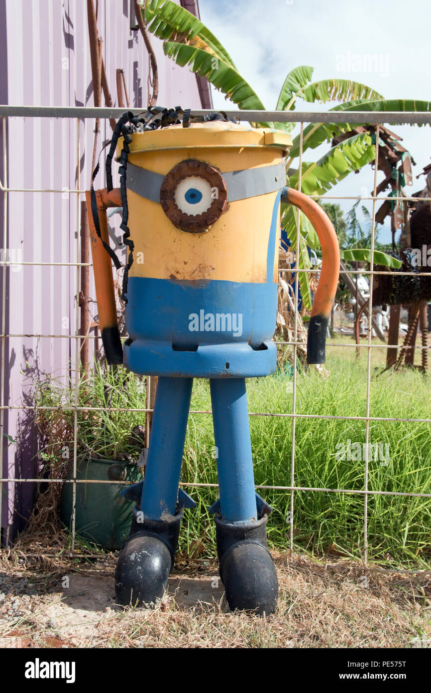 A Minion character trash can made from recycled scrap metal on the