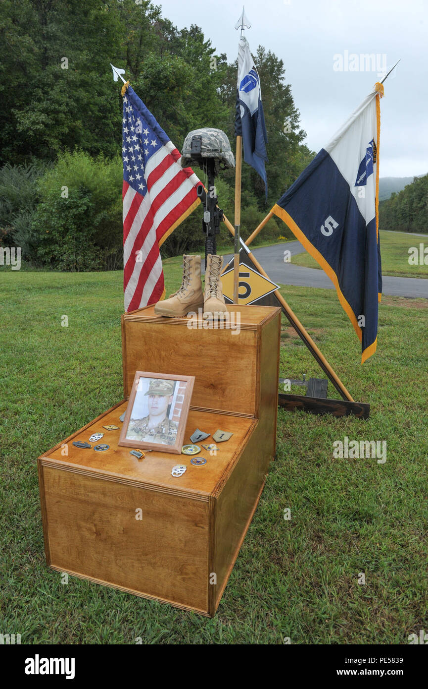 A combat field cross stands in remembrance of U.S. Army Pfc. Robert B