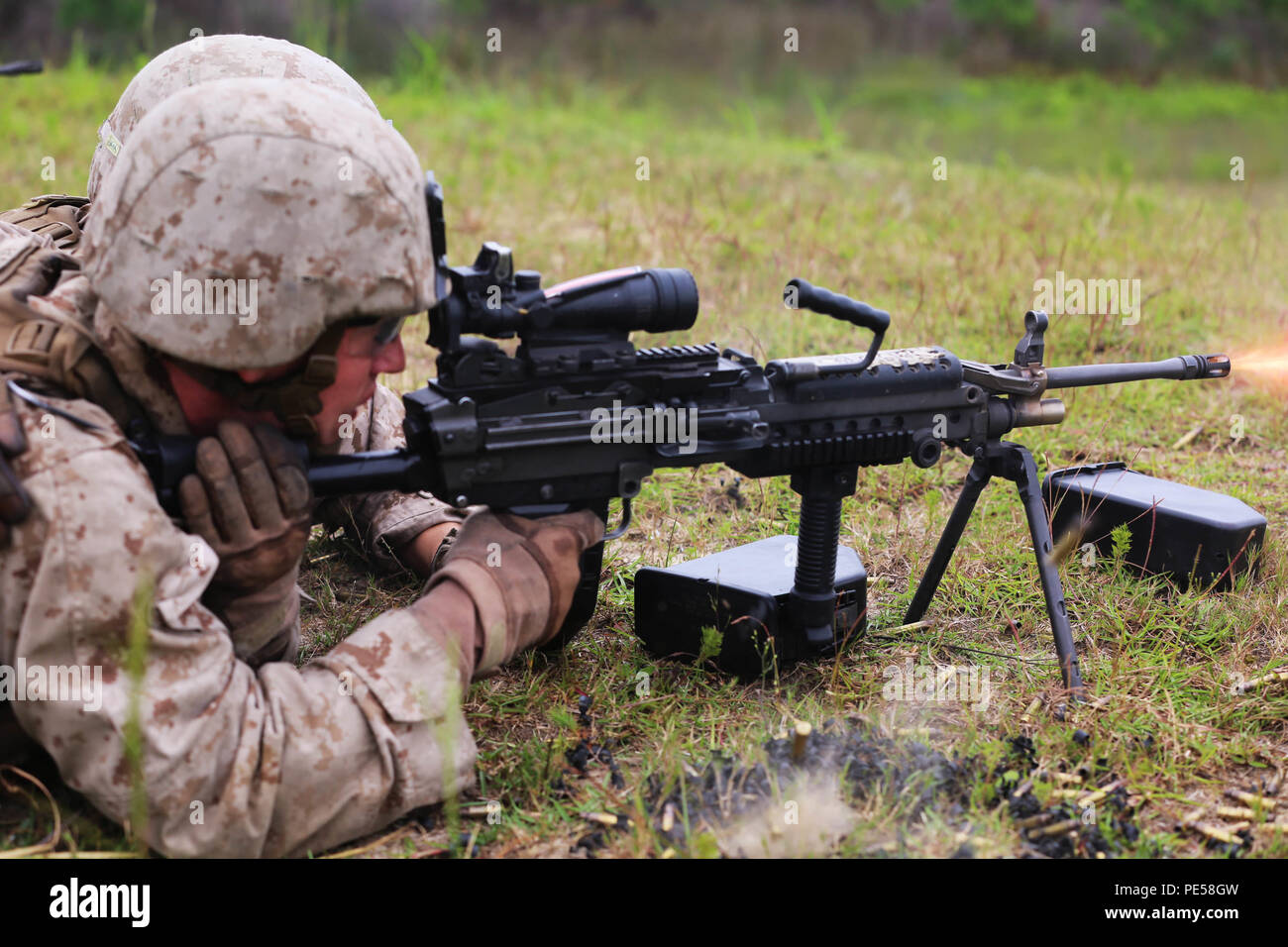A Marine with 1st Battalion, 8th Marine Regiment fires the M249 