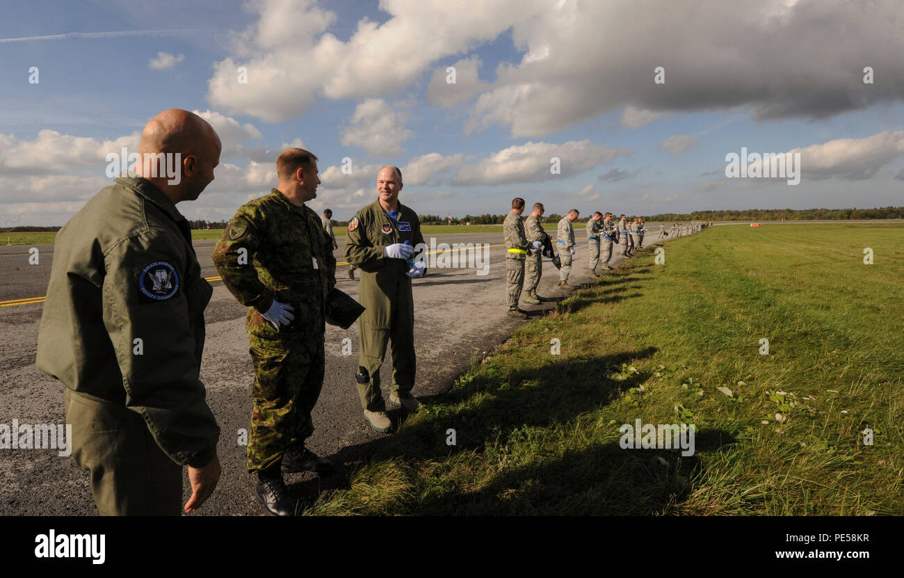 members-of-the-estonian-air-force-talk-to-us-air-force-lt-col-bryan-france-74th-expeditionary-fighter-squadron-commander-before-the-beginning-of-a-joint-foreign-object-debris-walk-on-the-flight-line-at-amari-air-base-estonia-sept-25-2015-the-combined-fod-walk-was-performed-to-search-for-trash-and-debris-that-could-damage-aircraft-us-air-force-photo-by-andrea-jenkinsreleased-PE58KR.jpg