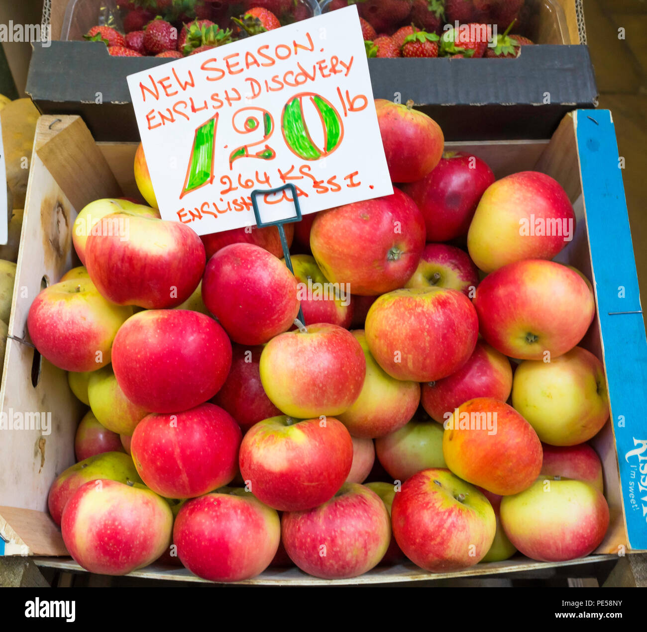 New Season English Class 1 Discovery apples for sale in greengrocers stall in Darlington County Durham priced at £1.20 per pound or £2.64 per Kilo Stock Photo