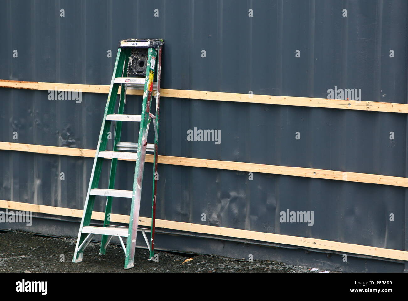 The ladders is leaning against the wall Stock Photo Alamy