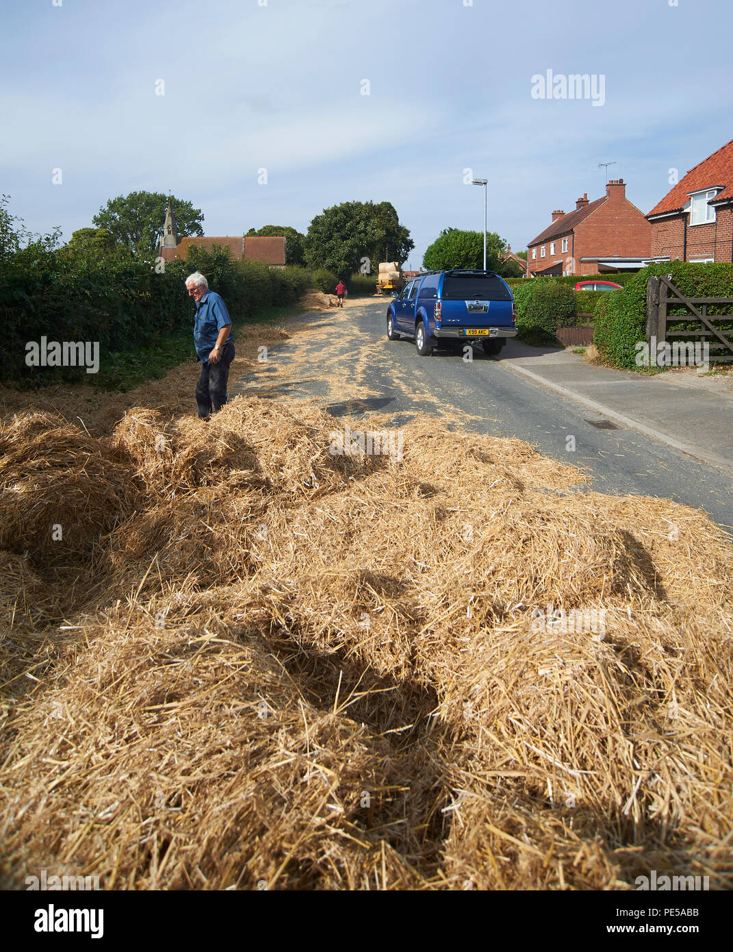 Straw Bales Fallen From Trailer In The Middle Of A Village In The East Riding Of Yorkshire England Uk Gb Stock Photo Alamy