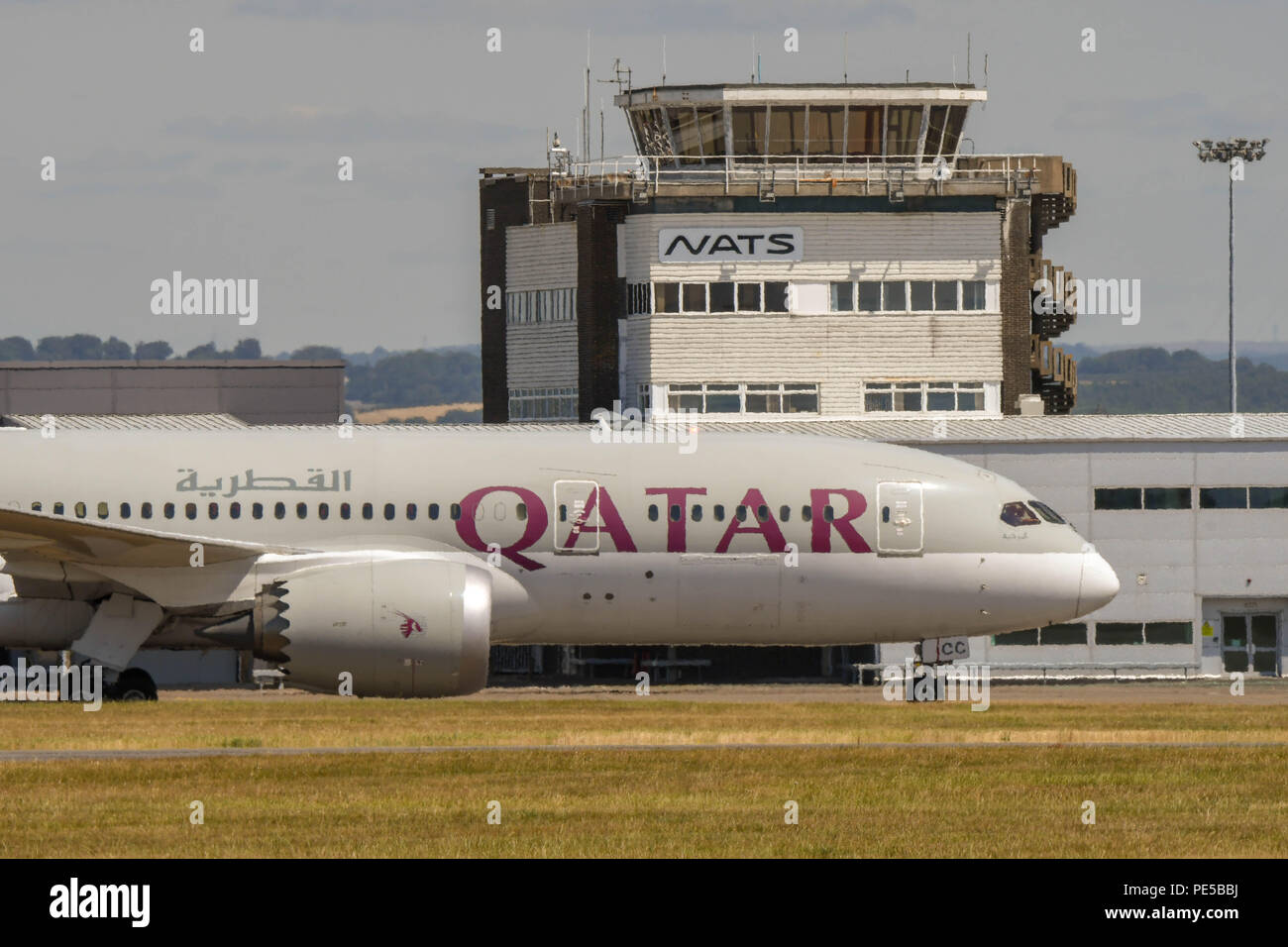 Qatar Airways Boeing 787 Dreamliner taxiing past the terminal building after landing at Cardiff Wales Airport. Stock Photo