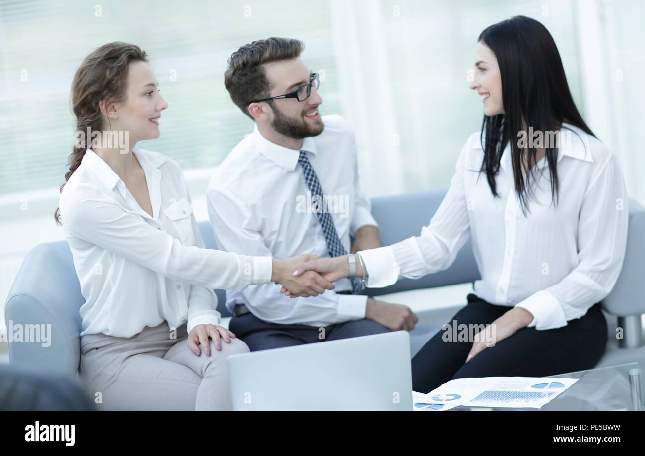 handshake of manager and client in the office lobby Stock Photo - Alamy