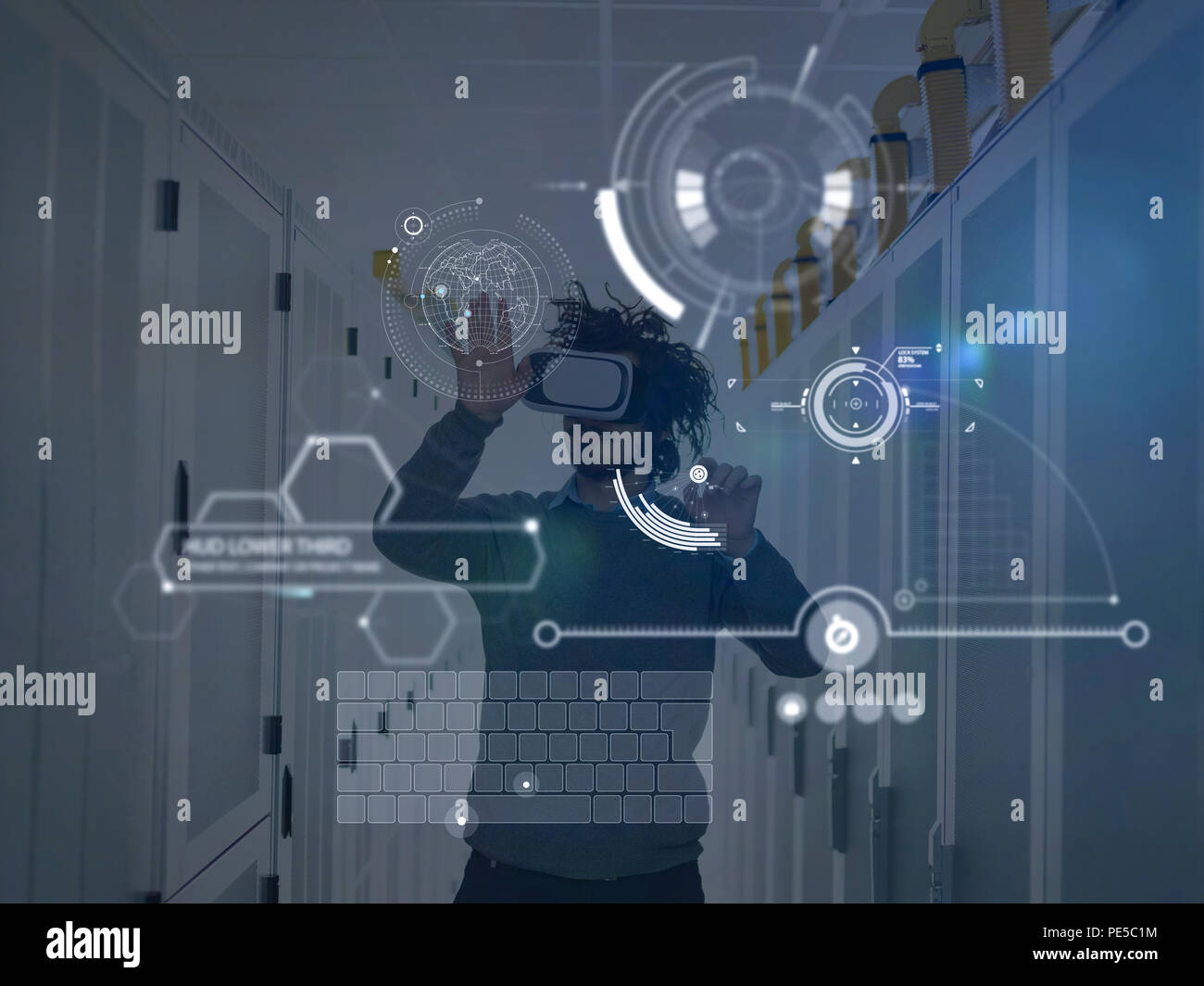 young IT engeneer using virtual reality headset over server room background Stock Photo