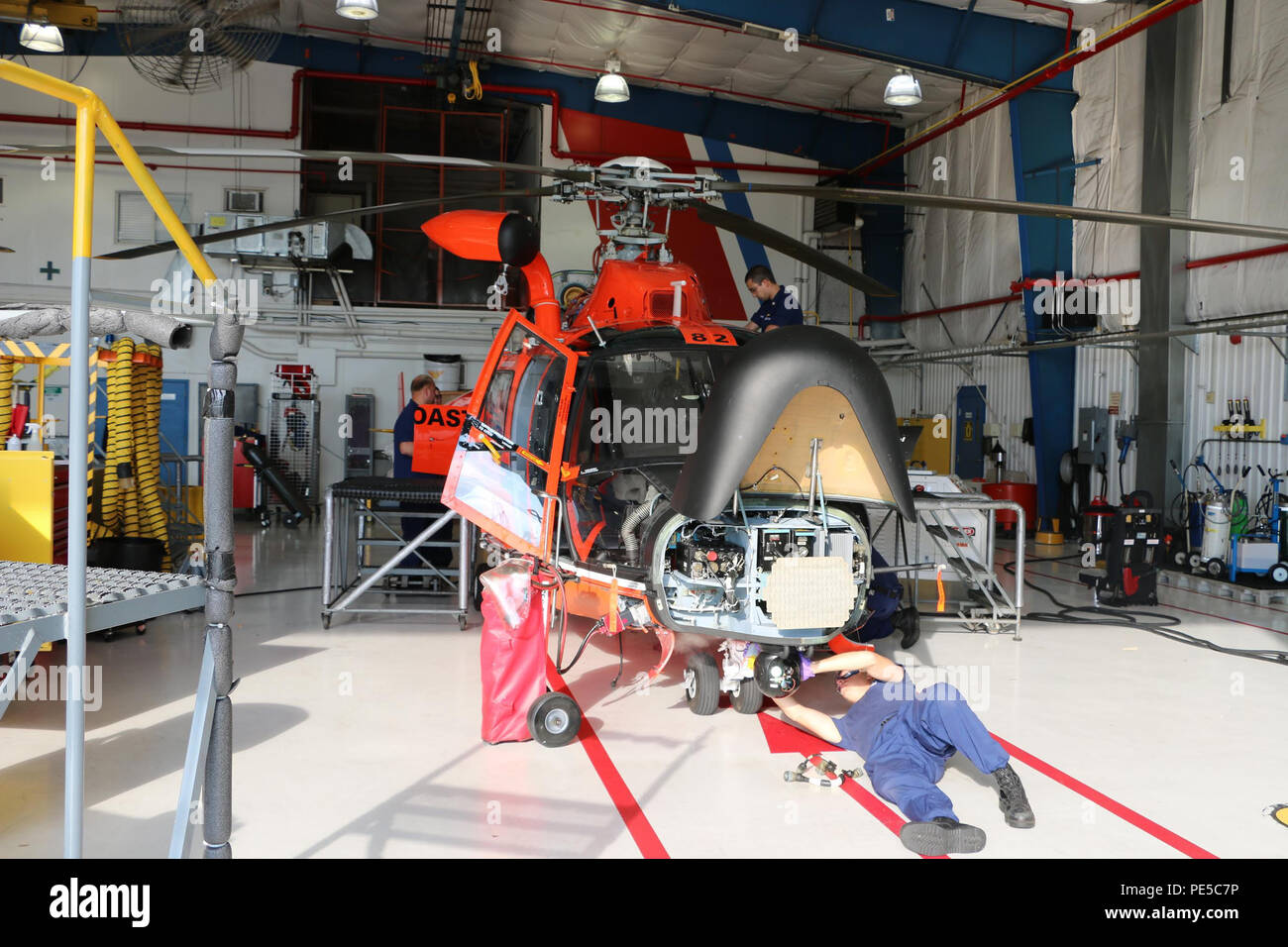 A maintenance crew from Coast Guard Air Station Detroit conducts hourly inspections and