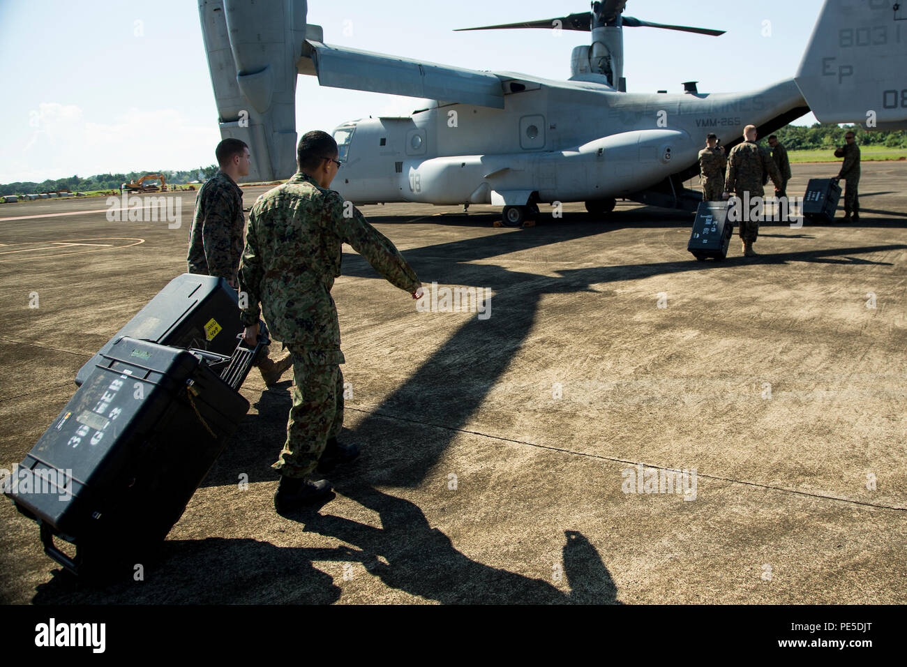 U.S. Marines with III Marine Expeditionary Force and a Japanese Ground  Self-Defense Force service member load gear into a U.S. Marine Corps MV-22  Osprey at Antonio Bautista Air Base in Palawan, Philippines,