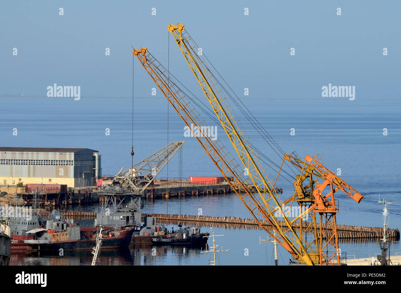Cranes and vessels at Bibiheybat shipyard in metropolitan Baku (Azerbaijan), Caspian Sea Stock Photo