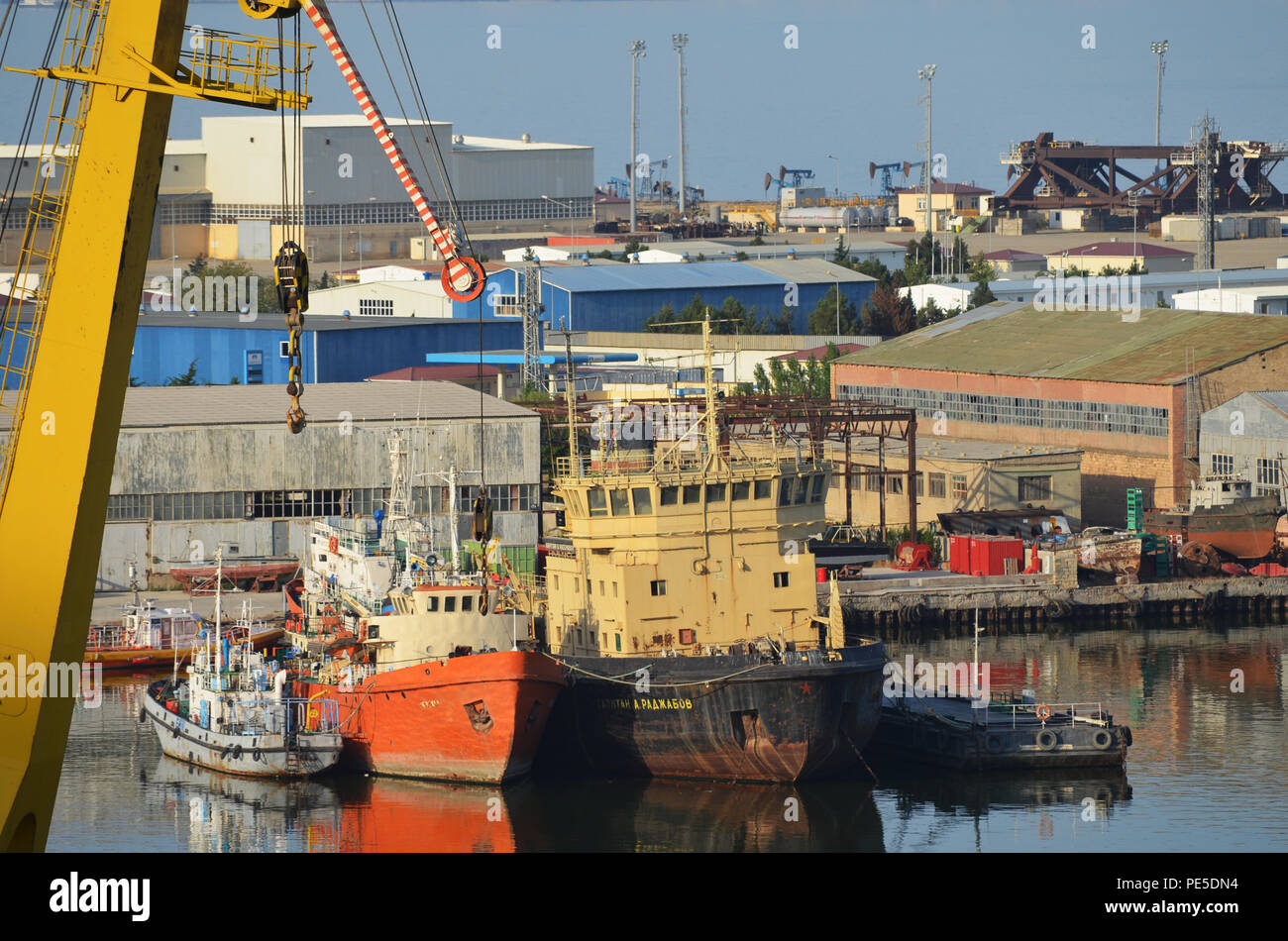 Cranes and vessels at Bibiheybat shipyard in metropolitan Baku (Azerbaijan), Caspian Sea Stock Photo