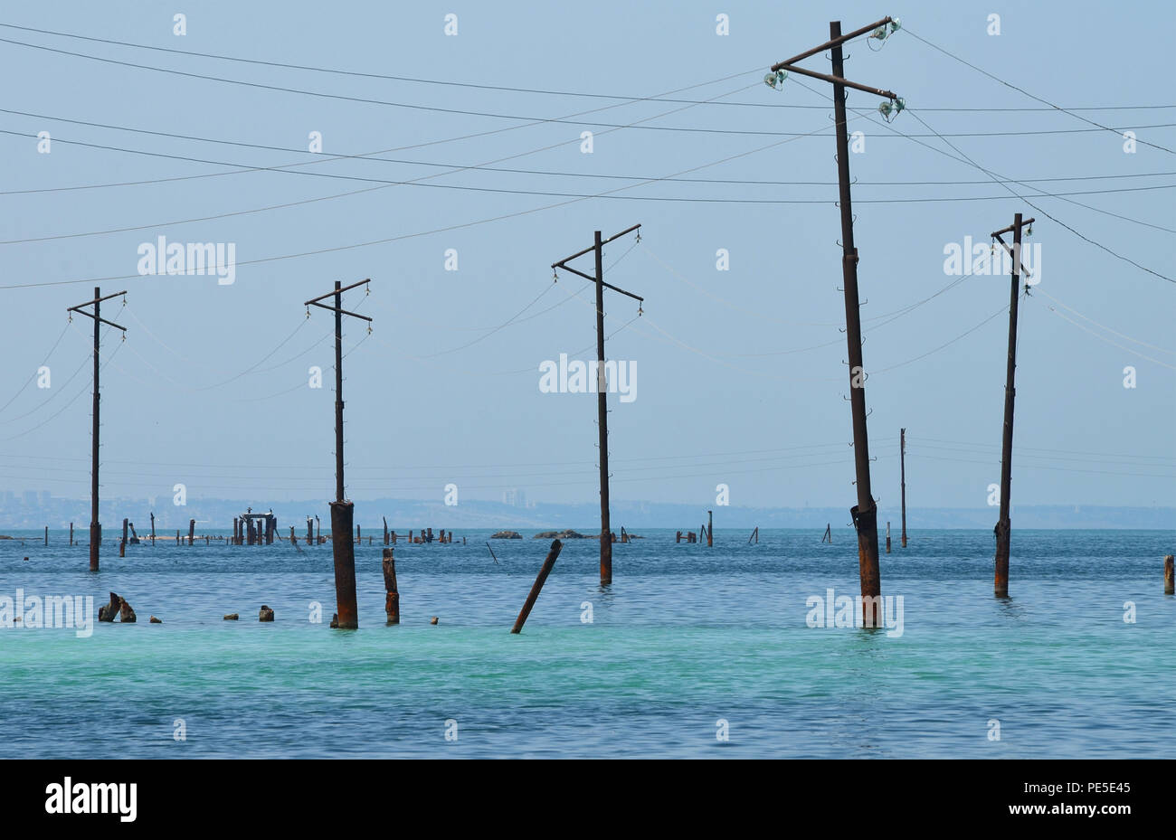 Power poles in the Caspian Sea, Absheron Peninsula, Azerbaijan Stock Photo