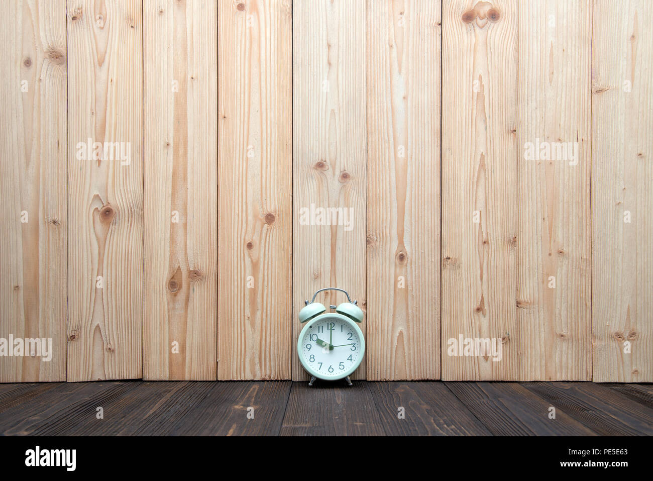 Retro vintage alarm clock on wood table, time concept idea Stock Photo
