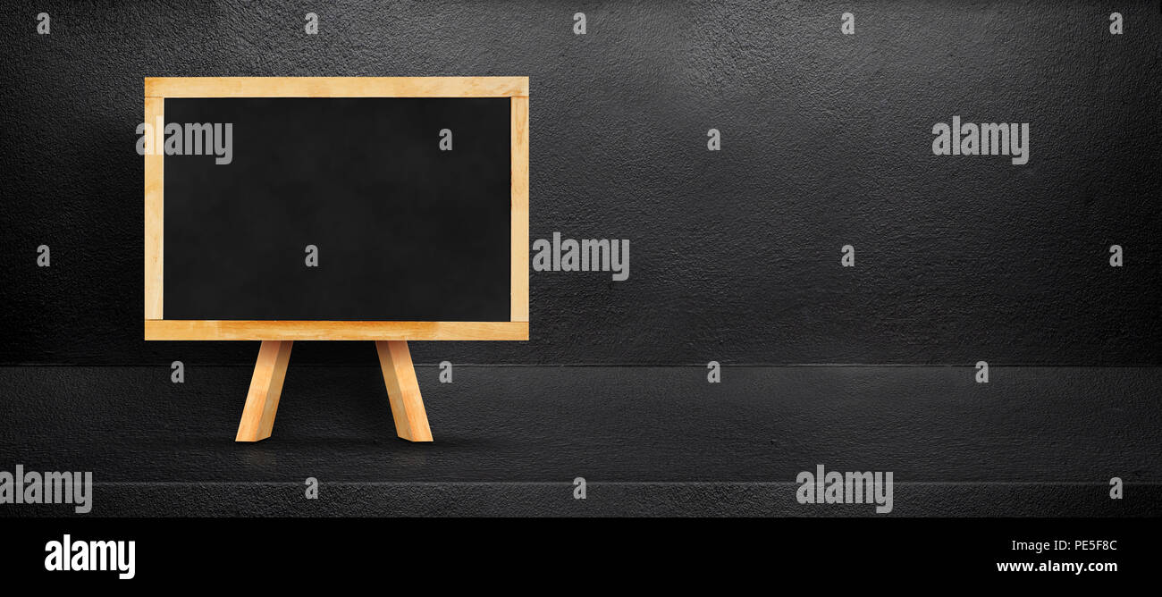 Blank Blackboard Leaning At Black Interior Cement Room Background