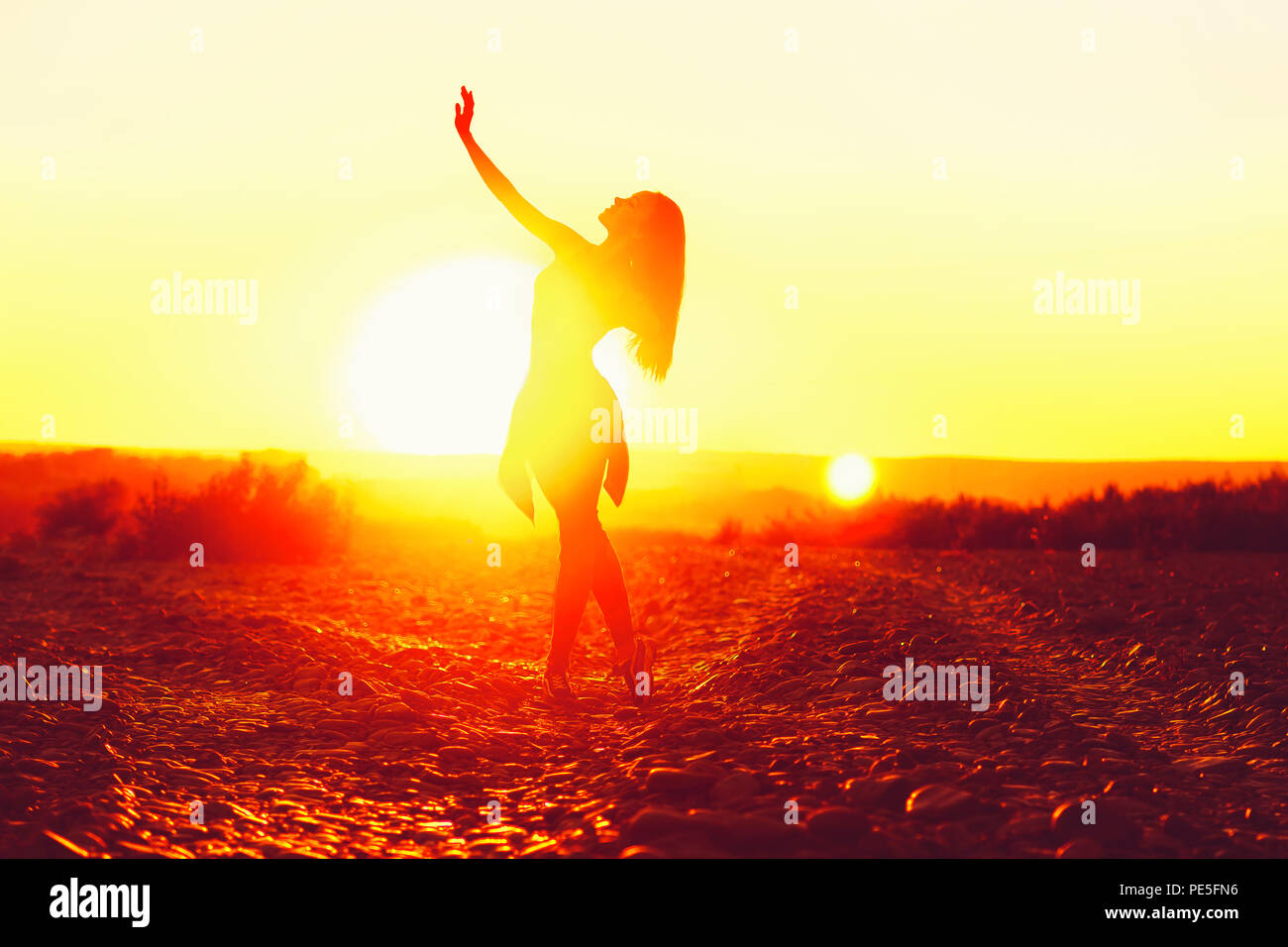Woman dancing beach jeans hi-res stock photography and images - Alamy
