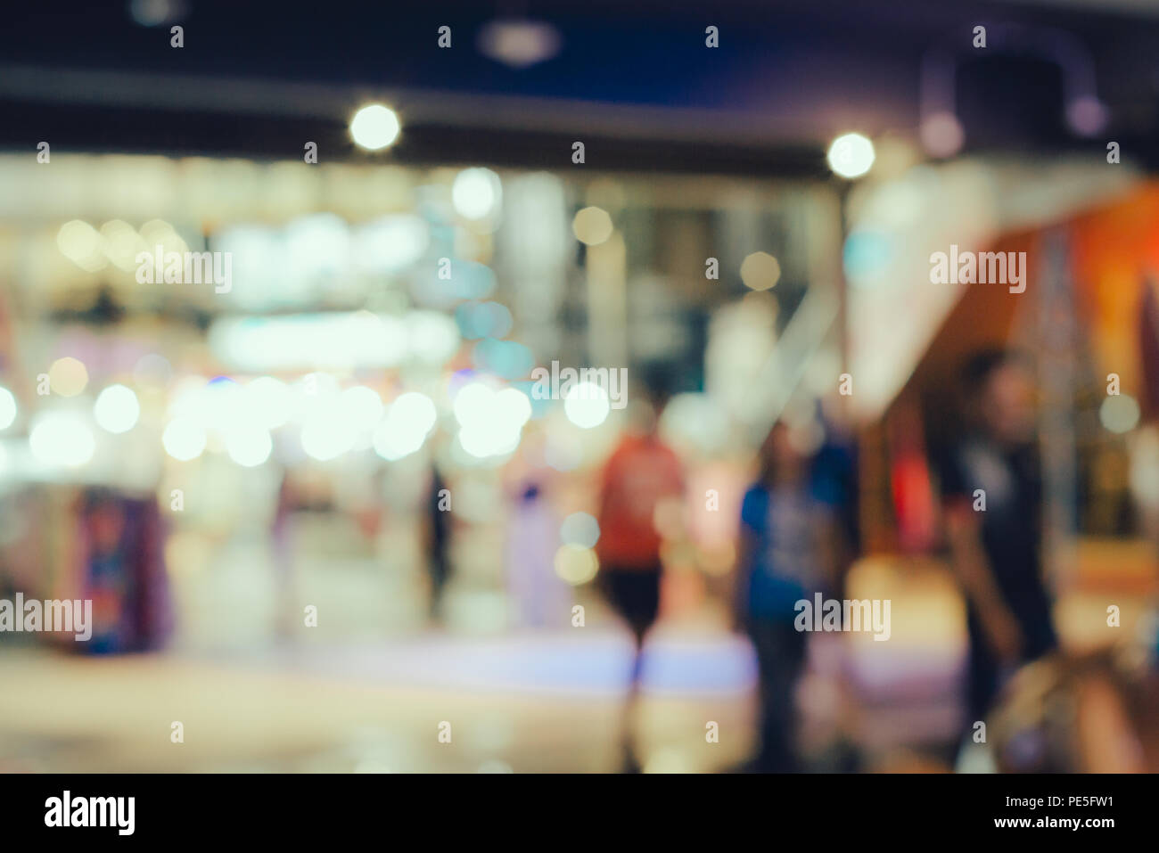 Abstract blurred people walking in shopping center Stock Photo - Alamy