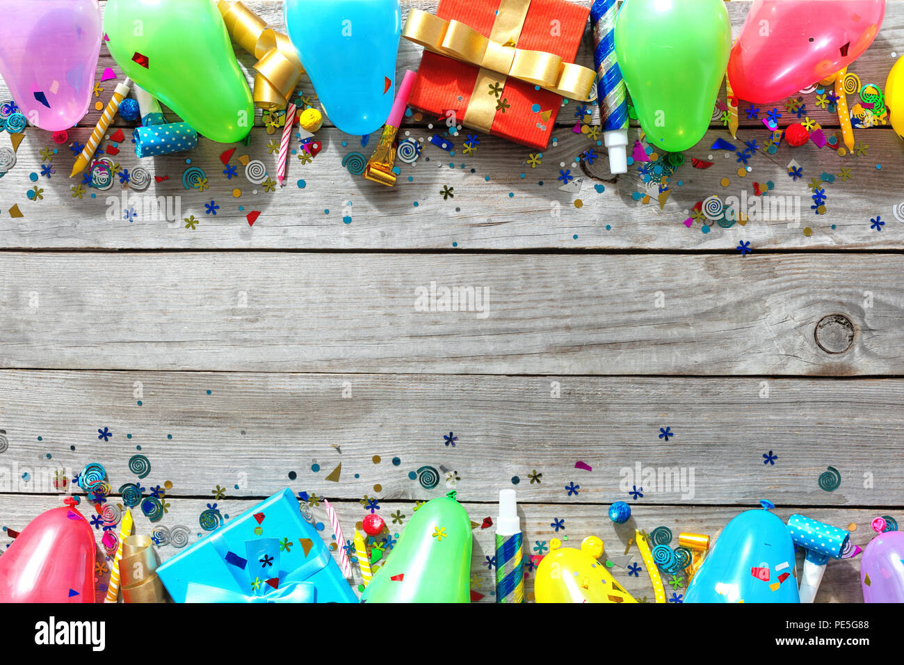 Frame of various decoration party on wooden table. Top view birthday