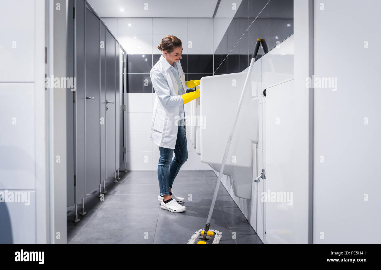 Janitor cleaning toilet hires stock photography and images Alamy