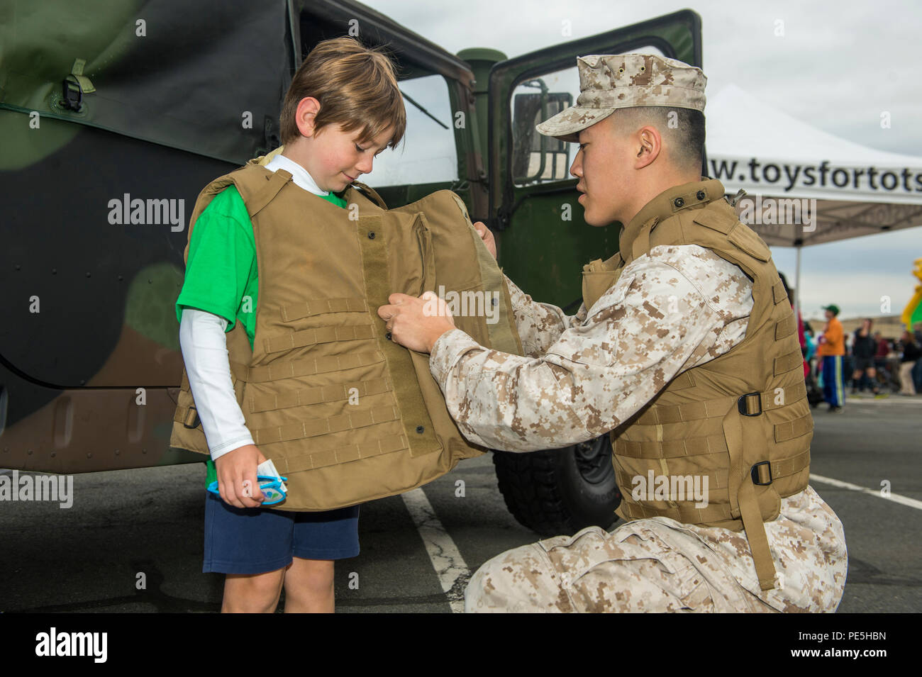 U.S. Marine Corps Lance Cpl. Yichen Yao demonstrates how to put on a
