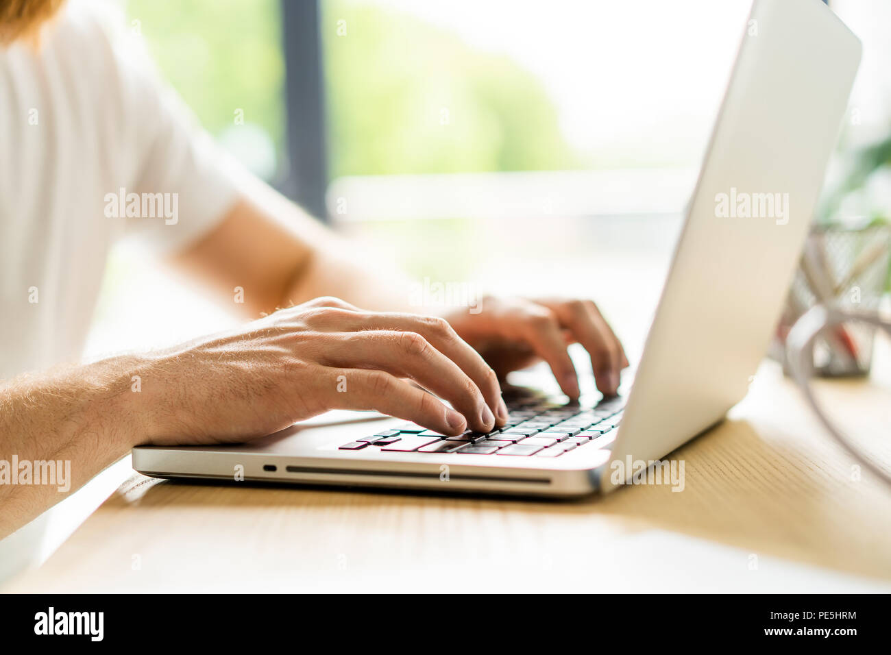 Man Using Keyboard Business man using laptop computer. Male hand typing on laptop keyboard ...