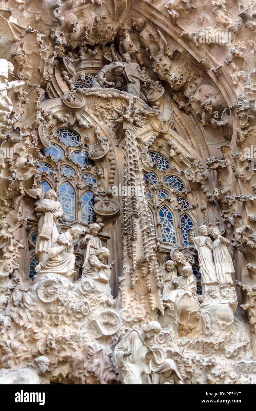 Sagrada Familia exterior, Nativity Facade - The Chorus of baby angels celebrating the birth of Jesus and looking over the manger. Stock Photo