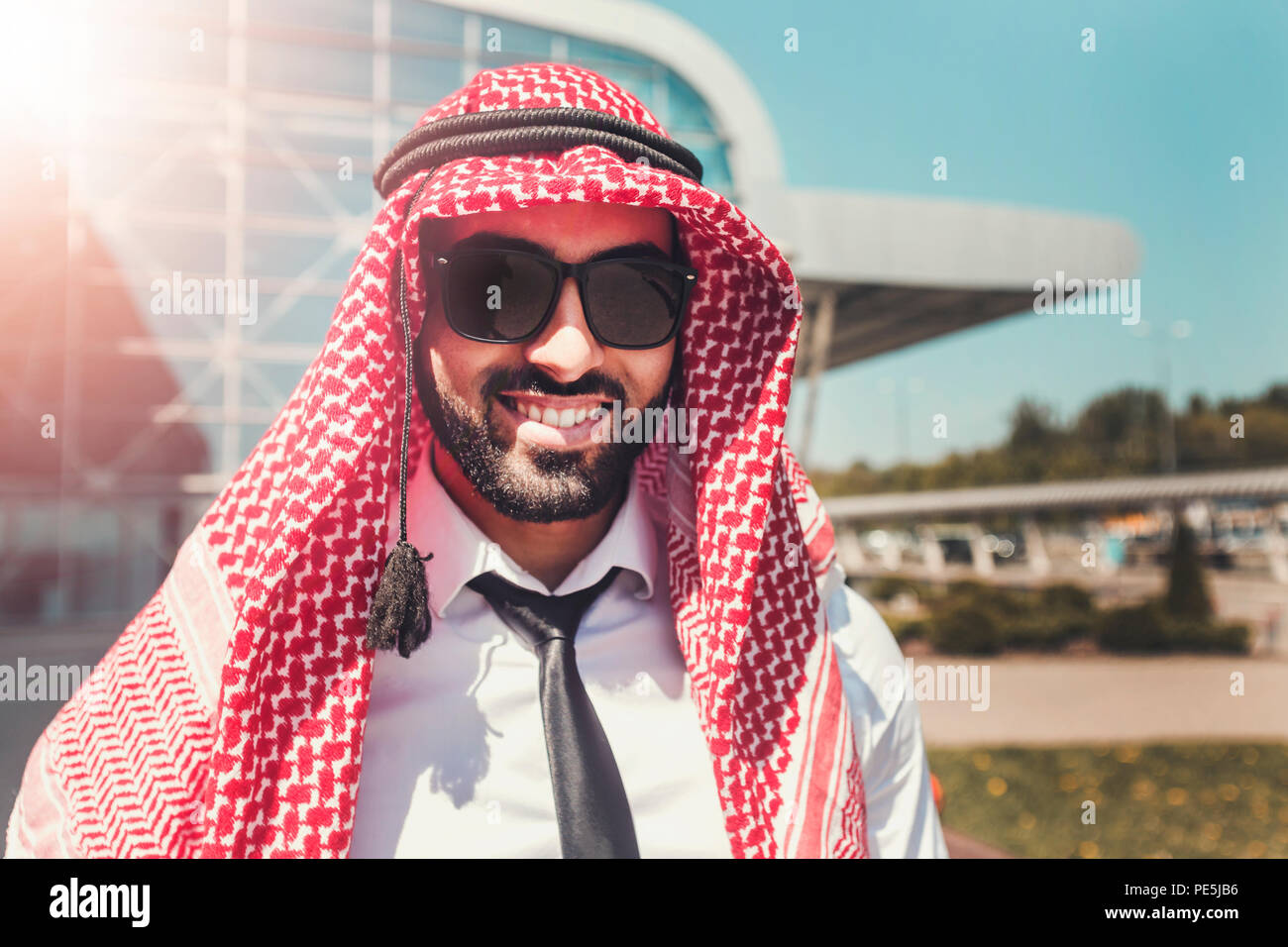 Portrait of arab man wears sunglasses and keffiyeh at the airport Stock Photo Alamy
