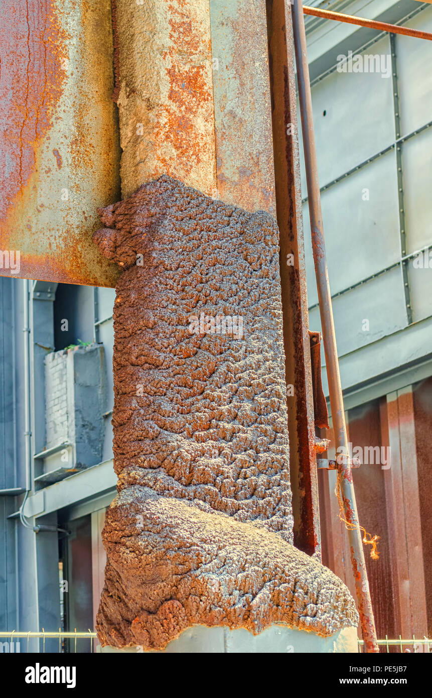 Molten iron, metal solidifies on a iron pillar Stock Photo