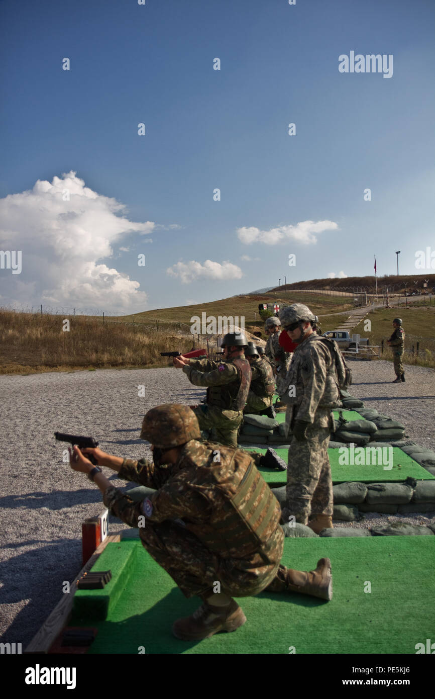 https://c8.alamy.com/comp/PE5KJ6/armenian-capt-albert-papikyan-along-with-turkish-soldiers-assigned-to-the-multinational-battle-group-east-southern-command-post-open-fire-during-an-m9-pistol-qualification-exercise-sept-23-2015-on-camp-bondsteel-kosovo-the-southern-command-post-also-known-as-task-force-hurricane-is-made-up-of-us-army-reserve-and-national-guard-soldiers-and-multinational-partners-dedicated-to-natos-peace-support-mission-in-kosovo-multinational-events-like-this-allow-the-battle-groups-soldiers-to-build-relationships-and-interoperability-between-partner-nations-us-army-photo-by-sgt-david-marq-PE5KJ6.jpg