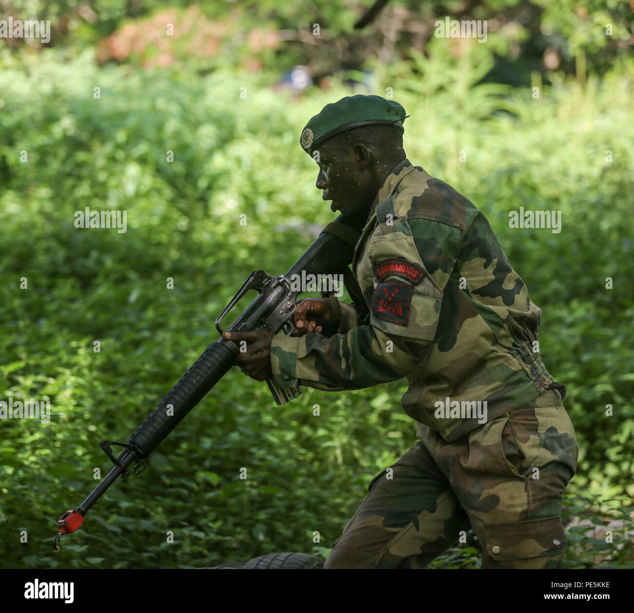 A Compagnie Fusilier de Marin Commando moves quickly to clear a ...