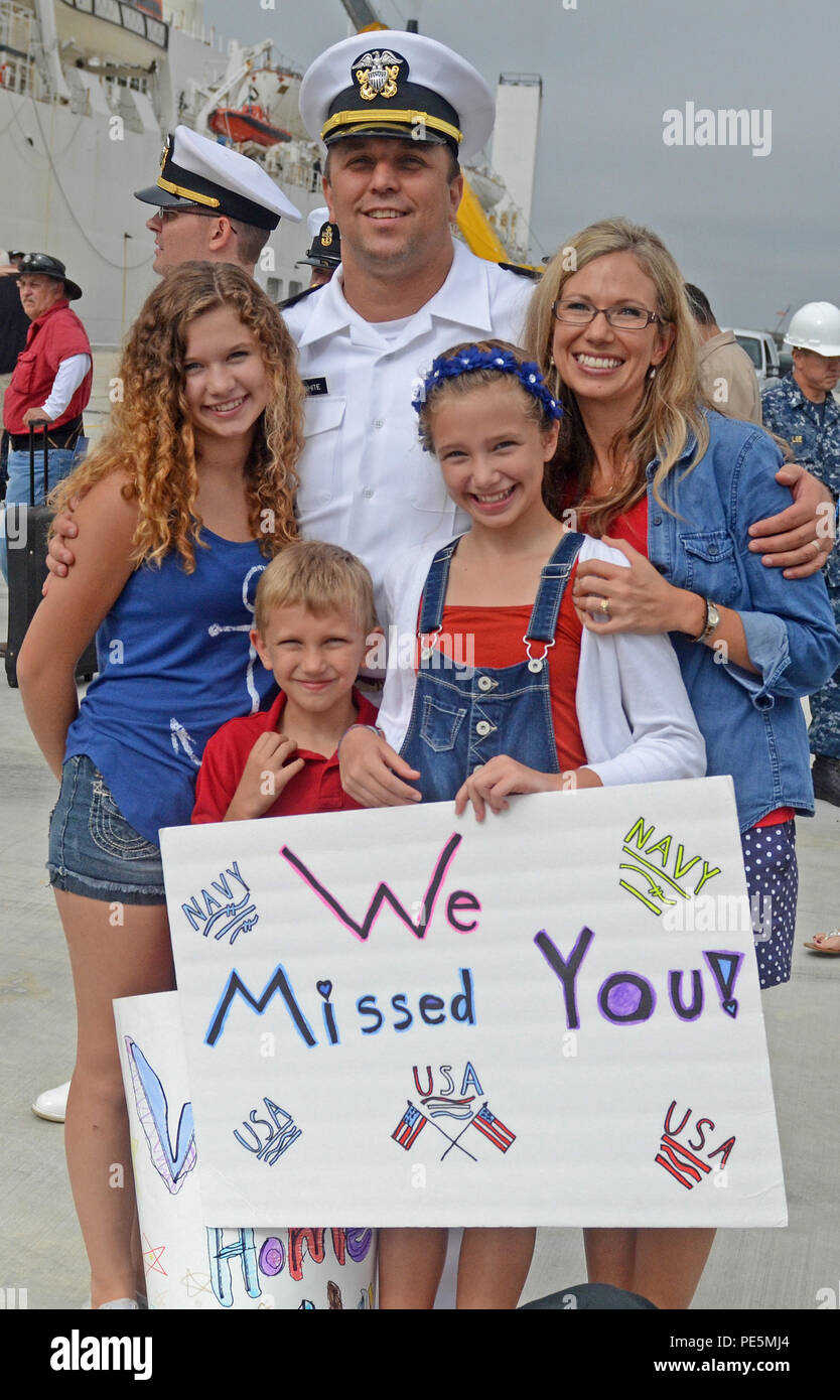 150925-N-AW702-005 JACKSONVILLE, Fla. (Sept. 25, 2015) Lt. Michael White, a registered nurse at Naval Hospital Jacksonville's intensive care unit, shares a moment with his family after a six month deployment aboard the Military Sealift Command hospital ship USNS Comfort (T-AH 20) in support of Continuing Promise 2015 (CP-15)‚ a humanitarian and civil assistance mission to 11 nations. The joint military and civilian crew, made of U.S. service members, partner nations and more than 400 non-governmental organization volunteers, conducted mission operations in Belize, Guatemala, Jamaica, Nicaragua Stock Photo