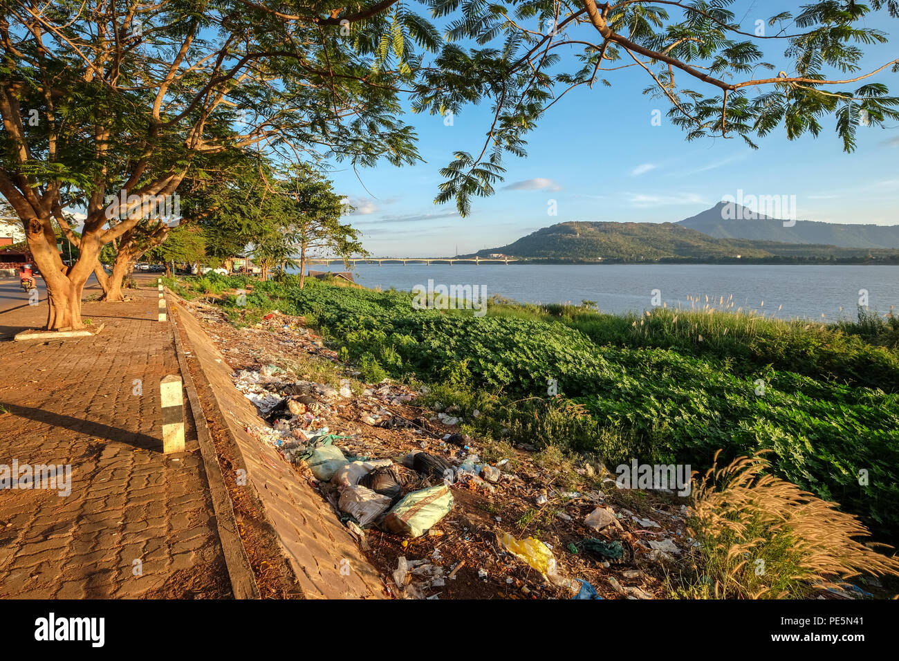 Plastic litter on the banks of the Mekong River in Pakse, Laos Stock Photo