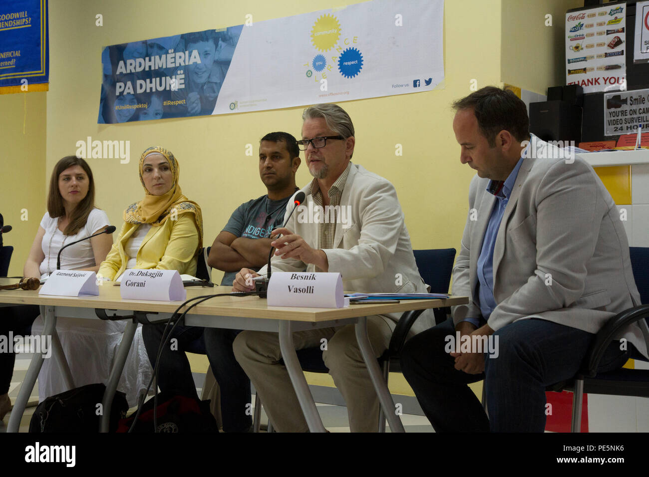 Dukagjin Gorani (second from right), an independent political analyst in Kosovo, speaks as a panel member during a Sept. 19, 2015, Violence Free Future tolerance workshop at a youth center in Mitrovica, Kosovo. The workshop, along with a Play2Educate youth event, was sponsored by the U.S. Embassy and led by Rotary Club Pristina to promote pro-social behaviors for young men and women in Kosovo regardless of gender or ethnic background. Hungarian and U.S. soldiers assigned to Multinational Battle Group-East attended the event as volunteers and mentors in order to demonstrate the importance of im Stock Photo