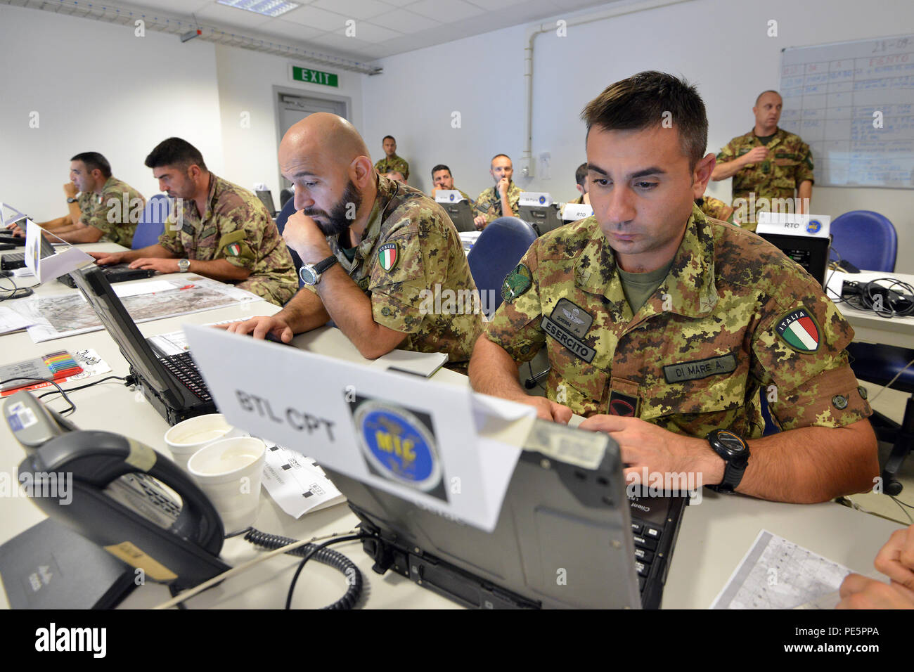 Italian Soldiers of the 183 Reggimento Paracadutisti Brigata Folgore Pistoia participate in NIE 16.1 (Network Integration Evaluation 16.1) exercise at Caserma Ederle Vicenza, Italy, Sept. 28, 2015. The NIE 16.1 is a multi-nation exercise designed to increase interoperability and communication between U.S. and NATO Friendly Force. (U.S. Army photo by Visual Information Specialist Paolo Bovo/released) Stock Photo
