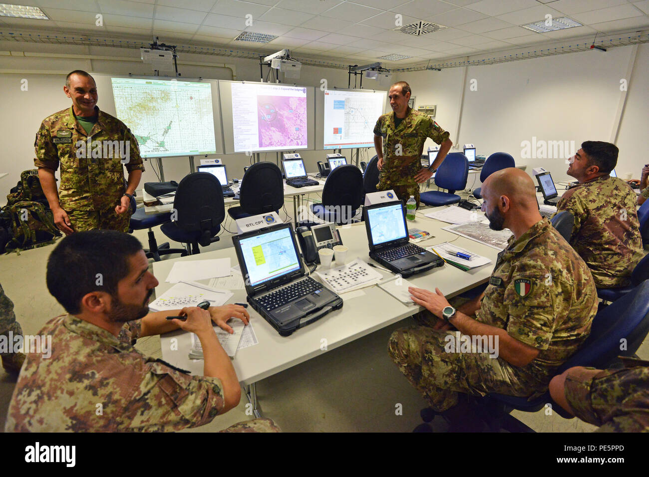 Italian soldiers of the 183 Reggimento Paracadutisti Brigata Folgore Pistoia participate in NIE 16.1 (Network Integration Evaluation 16.1) exercise at Caserma Ederle Vicenza, Italy, Sept. 28, 2015. The NIE 16.1 is a multi-nation exercise designed to increase interoperability and communication between U.S. and NATO Friendly Force. (U.S. Army photo by Visual Information Specialist Paolo Bovo/released) Stock Photo