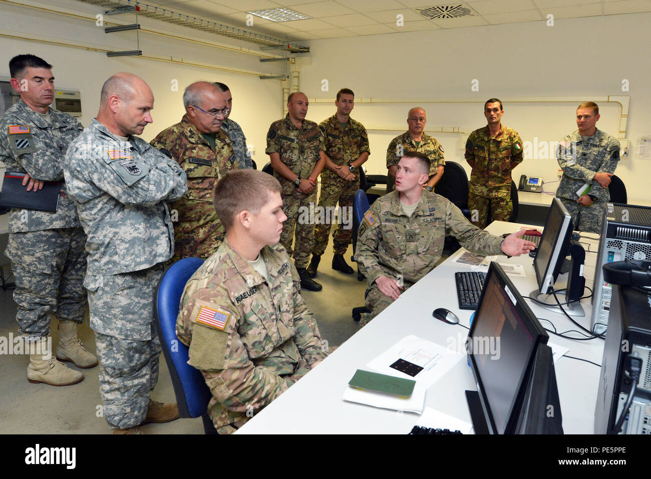 Brig. Gen. Christopher G. Cavoli, commander of the 7th Army Joint Multinational Training Command, and Brig. Gen. Salvatore Polimeno, commander of exercise CE.SI.VA observe NIE 16.1 (Network Integration Evaluation 16.1) exercise with U.S. and Italian Soldiers at Caserma Ederle Vicenza, Italy, Sept. 28, 2015. The NIE 16.1 is a multi-nation exercise designed to increase interoperability and communication between U.S. and NATO Friendly Force. (U.S. Army photo by Visual Information Specialist Paolo Bovo/released) Stock Photo