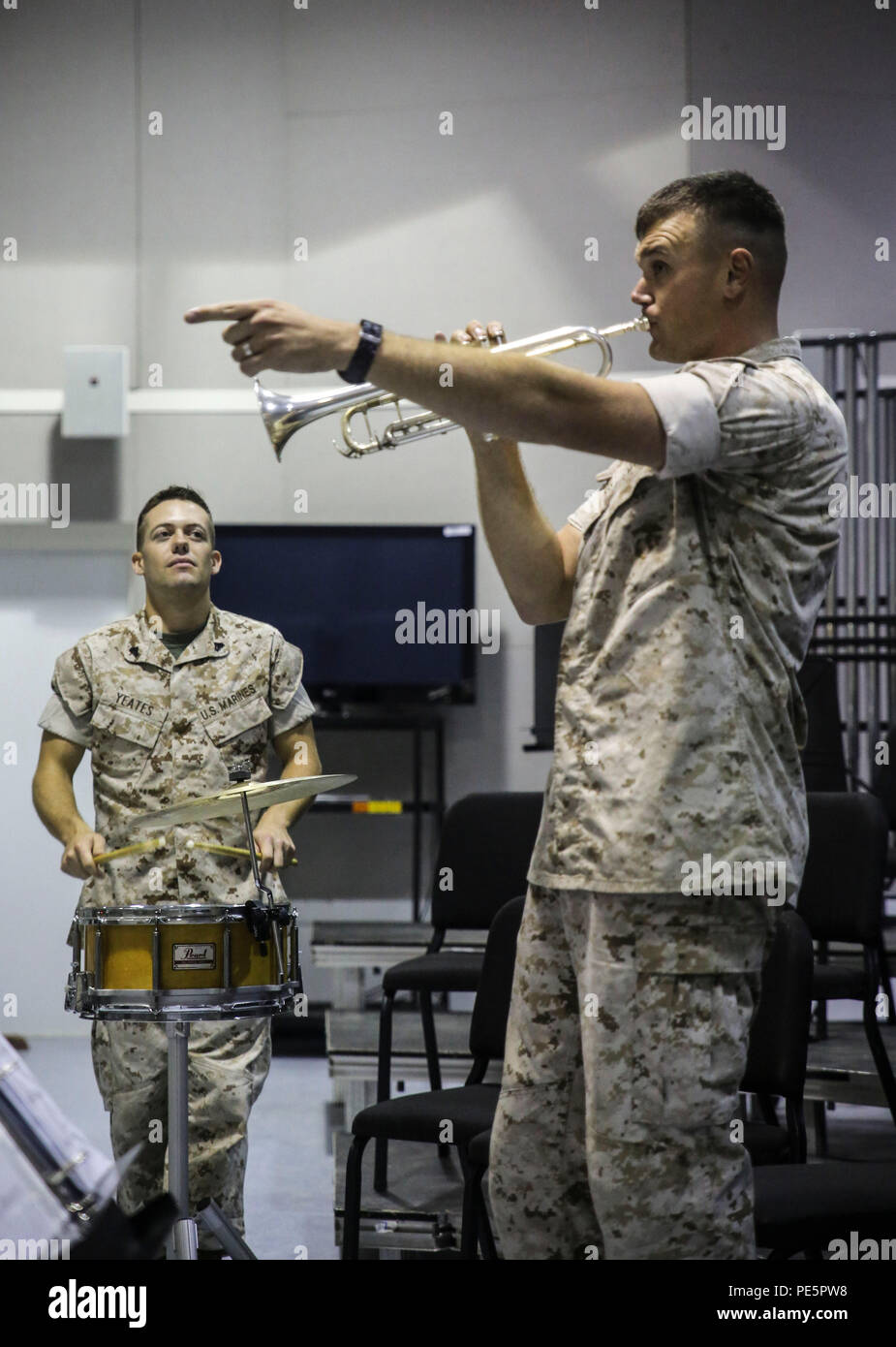 Sgt. Michael R. Hickey, right, a trumpeter with the 2nd Marine Division Band, leads the band in rehearsal for Amber N. Carter, a resident of Hubert, N.C., during her visit to the band’s command post at Camp Lejeune, N.C., Sept. 29, 2015. Amber always dreamed of joining the Marine Corps, but could not due to William’s syndrome. Staff Sgt. Isaiah Riley, a mess chief with 10th Marine Regiment, brought her and her family aboard the base to watch the band play. (U.S. Marine Corps photo by Cpl. Paul S. Martinez/Released) Stock Photo