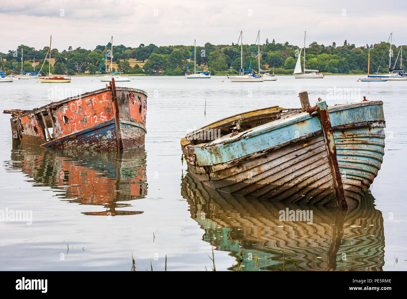 decaying adandoned boats on the river orwell estuary near pin mill on suffolk Stock Photo