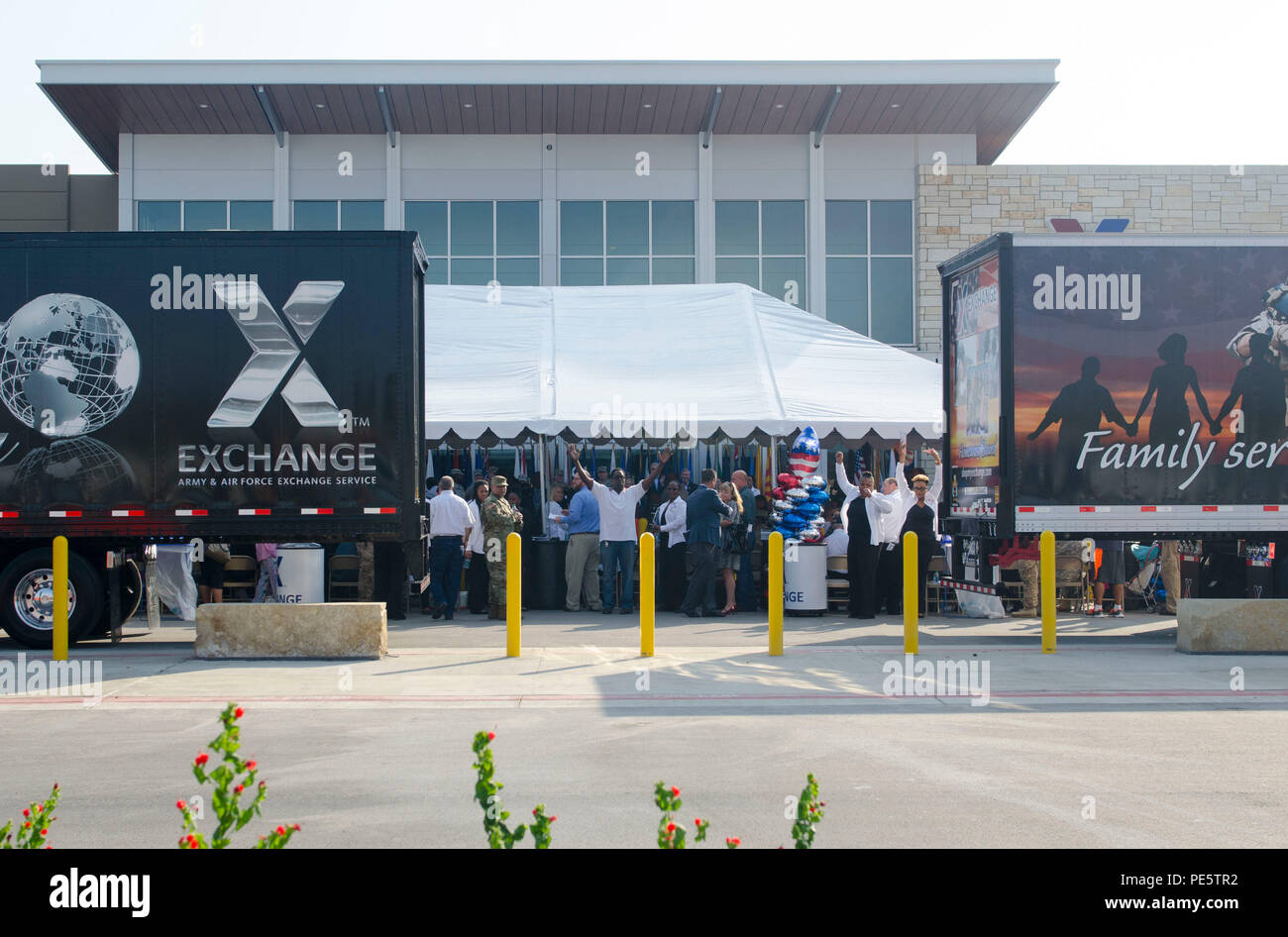 Trailer trucks pull apart in front of the new Fort Hood Post Exchange