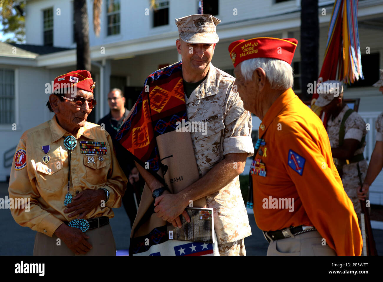 Major Gen. Daniel O’Donohue, commanding general, 1st Marine Division, pays respect to retired Navajo Code Talkers during a tour with the Navajo Nation aboard Marine Corps Base Camp Pendleton, Calif., Sept. 28, 2015. Navajo Code Talkers were first put into action during World War II in early 1942 to establish an undecipherable code which could be used in combat environments to communicate sensitive information. (U.S. Marine Corps photo by Cpl. Demetrius Morgan/RELEASED) Stock Photo