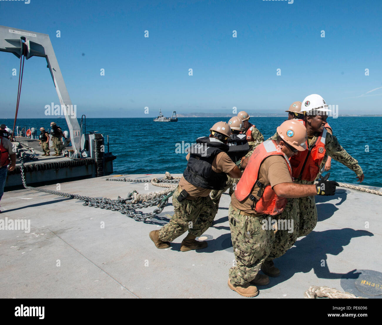 Acb Inls Sailors from Amphibious Construction Battalions 1 and 2 position an ...