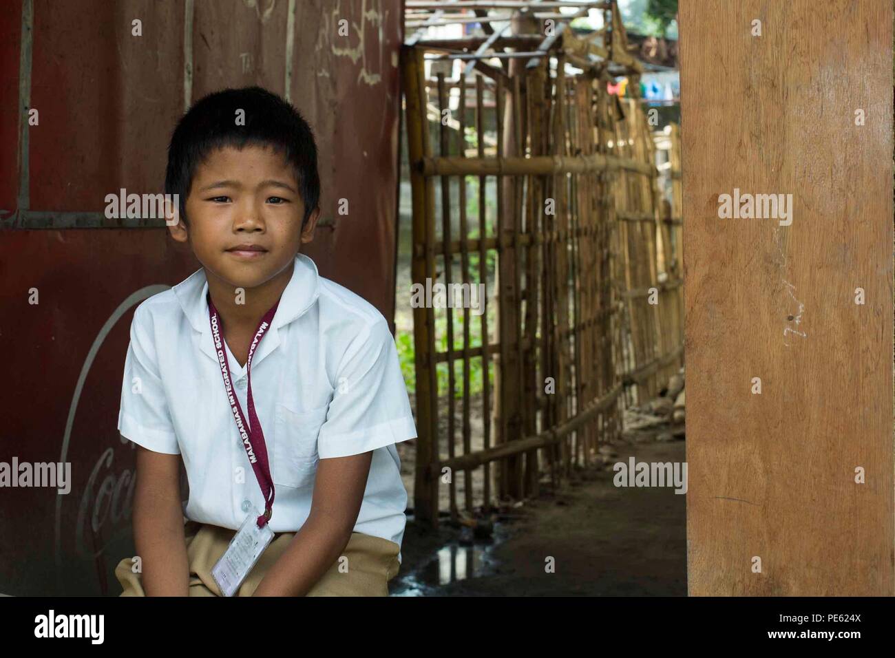 A student from Malabanias Integrated School sits outside a classroom ...