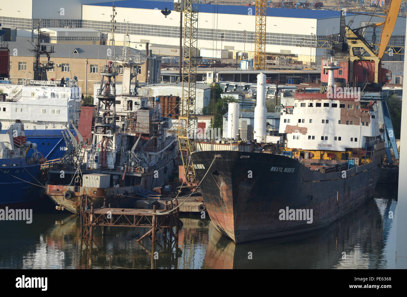 Offshore oil and gas industry vessels at Bibiheybat shipyard in metropolitan Baku (Azerbaijan), Caspian Sea Stock Photo