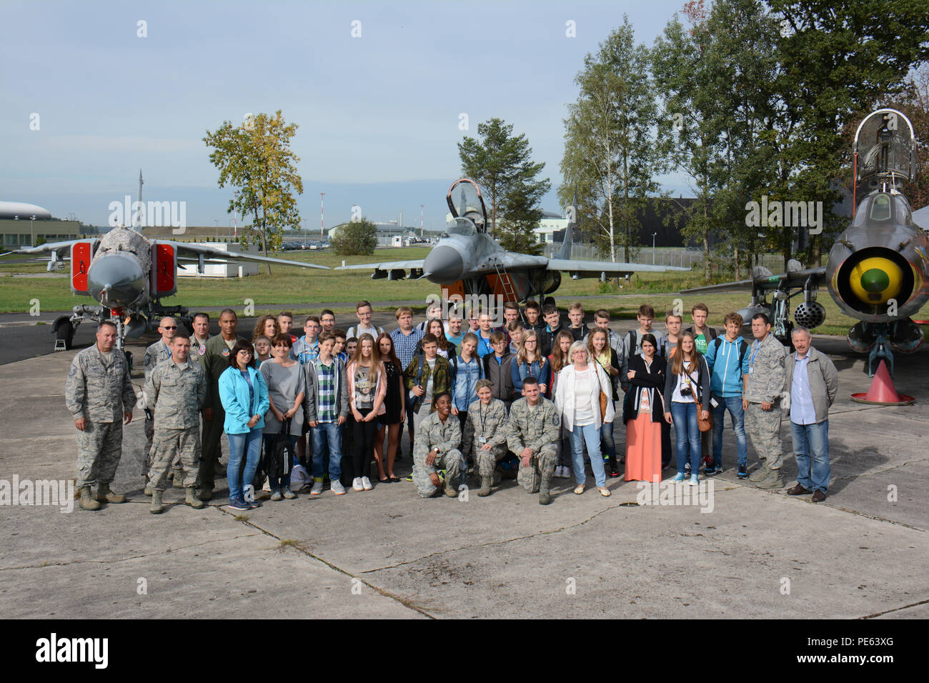 Members of the Wisconsin Air National Guard's 115th Fighter Wing host a base tour for middle school students from Gimnazjum NR 1 Sept. 15, 2015, while deployed in support of U.S. Aviation Detachment Rotation 15-4 at Łask Air Base, Poland. Through the National Guard State Partnership Program, the 115th Fighter Wing has established an enduring relationship with the 10th Fighter Squadron at Łask, to include engaging in community relations activities in nearby Polish communities. (U.S. Air National Guard Photo by Master Sgt. Paul Gorman/Released) Stock Photo