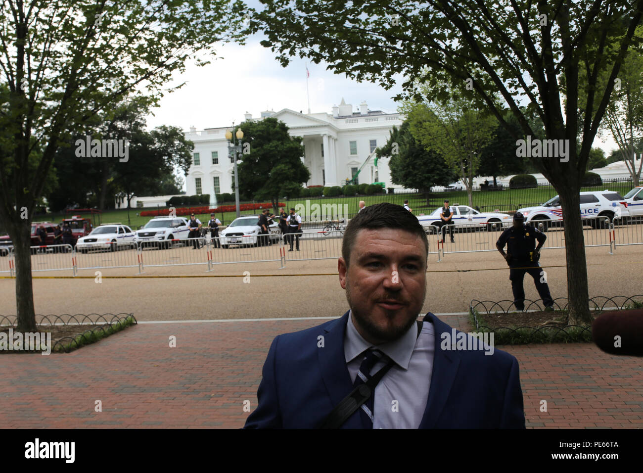 Washington, DC, USA. 12 Aug 2018. Jason Kessler, leader of the Unite the Right protest, gives an interview in front of the White House. Credit: Joseph Gruber/Alamy Live News Stock Photo
