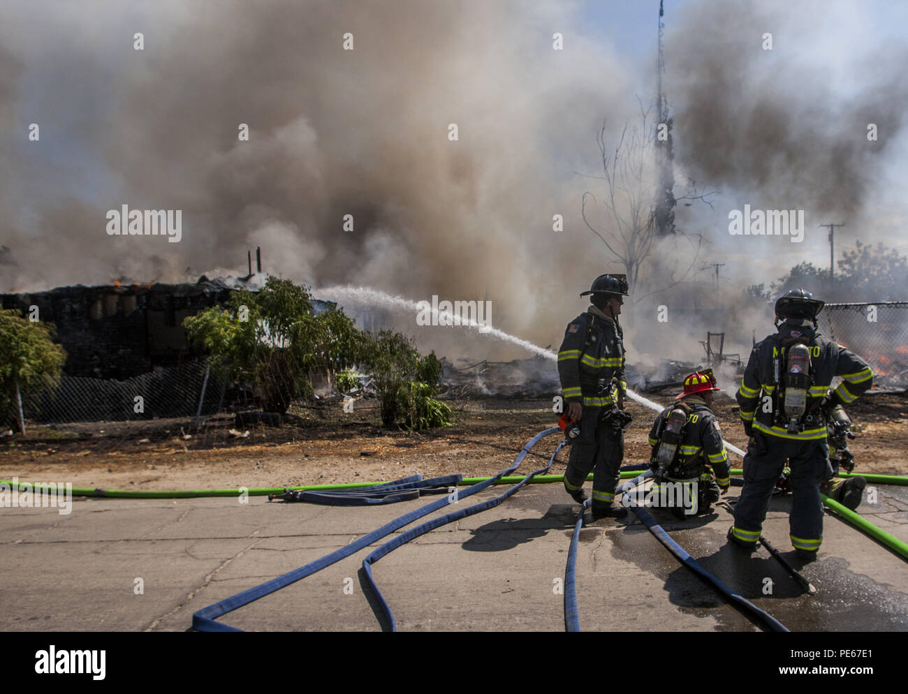 Modesto, California, U.S.A. 12th Aug, 2018. A home and field at the corner of Seattle Street and Amador Avenue in West Modesto, CA were destroyed by a fast moving fire Sunday Aug. 12, 2018. Modesto Fire Department along with Ceres and Stanislaus Consolidated responded to the two alarm fire. No injuries were reported. Credit: Marty Bicek/ZUMA Wire/Alamy Live News Stock Photo