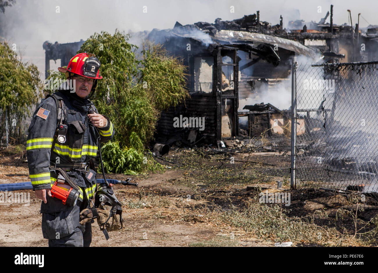 Modesto, California, U.S.A. 12th Aug, 2018. A home and field at the corner of Seattle Street and Amador Avenue in West Modesto, CA were destroyed by a fast moving fire Sunday Aug. 12, 2018. Modesto Fire Department along with Ceres and Stanislaus Consolidated responded to the two alarm fire. No injuries were reported. Credit: Marty Bicek/ZUMA Wire/Alamy Live News Stock Photo