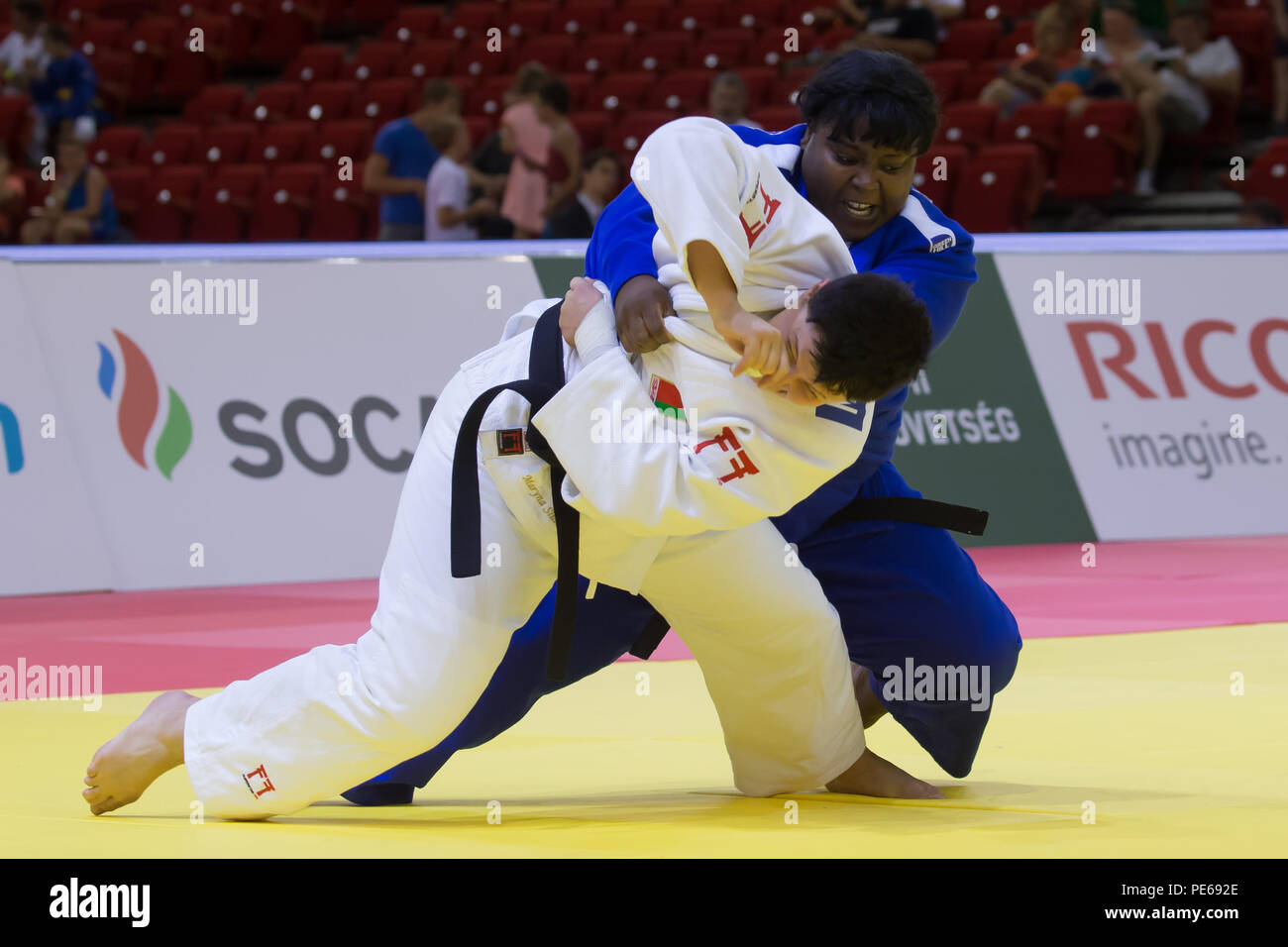 Budapest. 12th Aug, 2018. Idalys Ortiz (Back) of Cuba and Maryna Slutskaya of Belarus fight during the final of Women's  78kg category at the Judo World Grand Prix 2018 in Budapest, Hungary on Aug. 12, 2018. Idalys Ortiz won the gold medal. Credit: Attila Volgyi/Xinhua/Alamy Live News Stock Photo