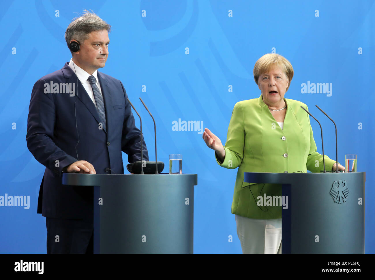 Berlin, Germany. 13th Aug, 2018. German Chancellor Angela Merkel (R) of the Christian Democratic Union (CDU) and the Chairman of the Council of Ministers of Bosnia and Herzegovina, Denis Zvizdic, hold a joint press conference. Credit: Wolfgang Kumm/dpa/Alamy Live News Stock Photo