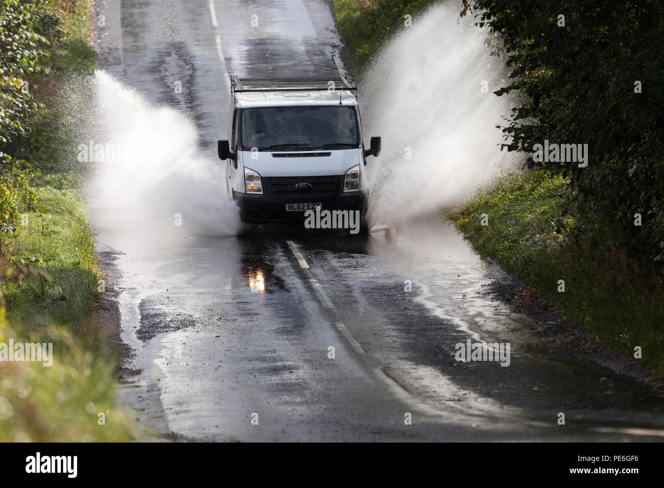 Barnard Castle, Teesdale, County Durham, UK.  Monday 13th August 2018.  UK Weather.  Torrential rain has flooded some roads in the area around Barnard Castle this afternoon, creating hazardous driving conditions. Credit: David Forster/Alamy Live News Stock Photo